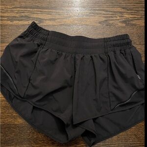 Black ,short, built in underwear, has one zippered pocket